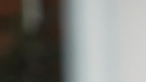 Close-up of African American candidate giving her CV to human resource manager on a job interview in the office.